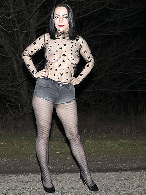 woman in draw a understand dress flaunts her titties