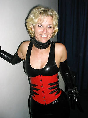 low-spirited women in latex stripped